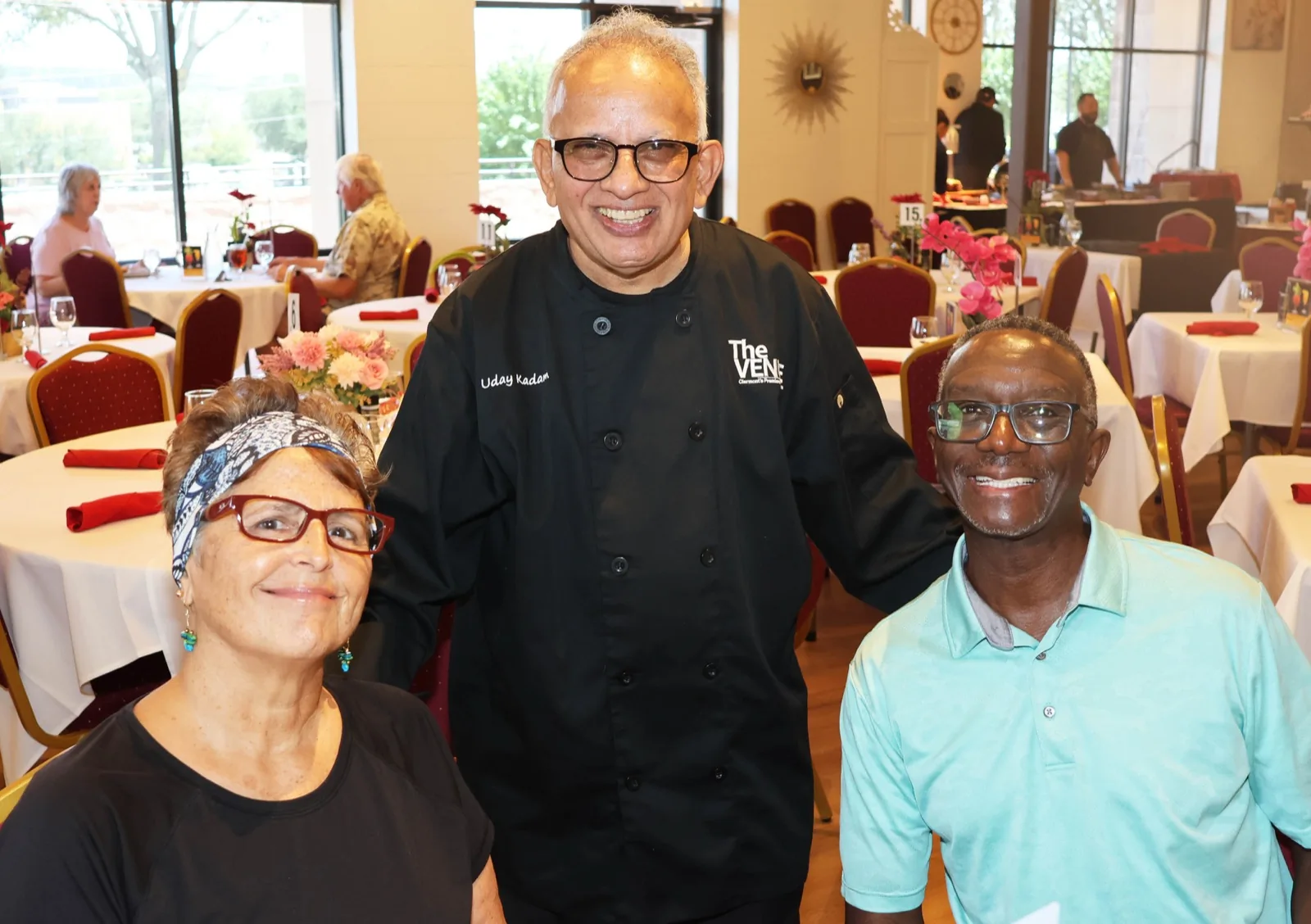 Owner Uday Kadam with Sunday brunch guests in the dining room at The Venue Clermont